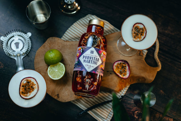Natural & Noble Pornstar Martini Cocktail Kit, next to Pornstar Martini’s and Fresh Fruit