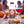 Bottle of 'Sex on the Beach' cocktail mix with a blurred social setting in the background