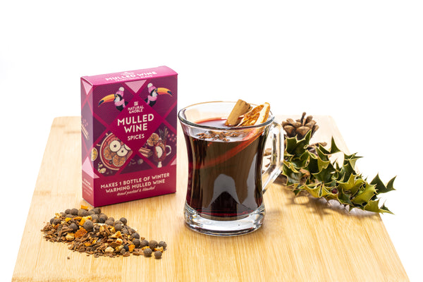 Three packaged mulling spice blends from Natural & Noble, each designed for making mulled wine, cider, and gin. The packages are u and illustrate the contents and instructions for use.